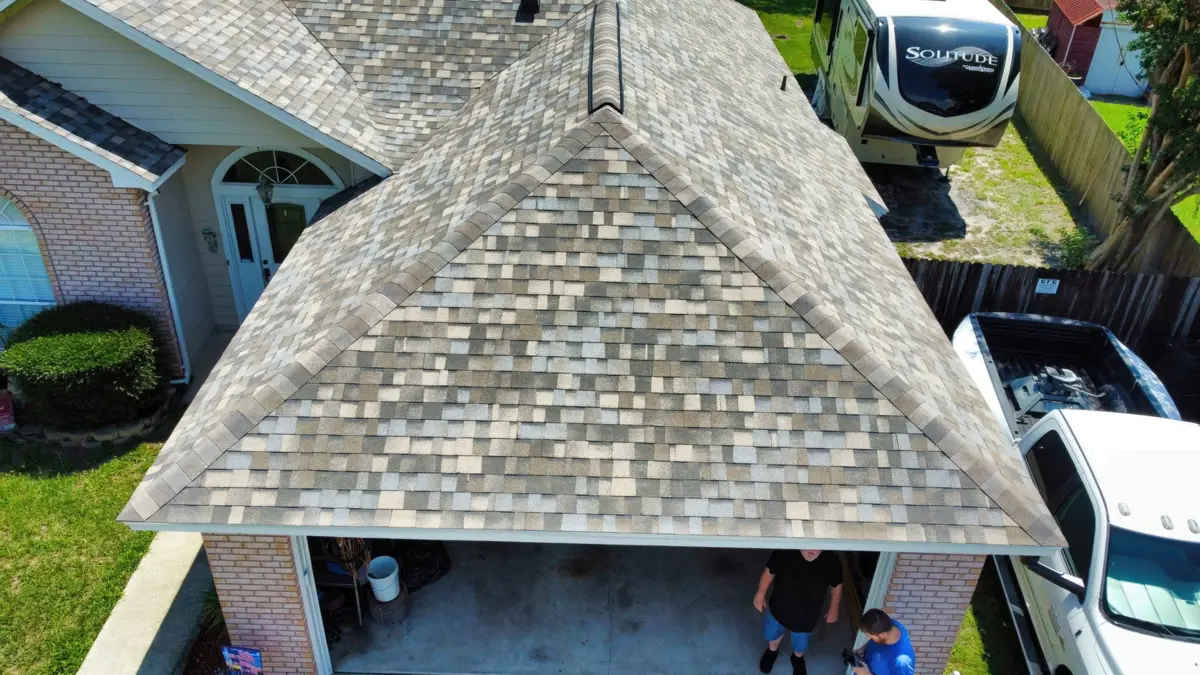 Aerial view of a completed hip roof on a two-car garage home